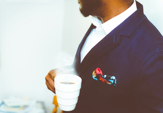 Man with Coffee Cup Photo by Adeolu Eletu on Unsplash