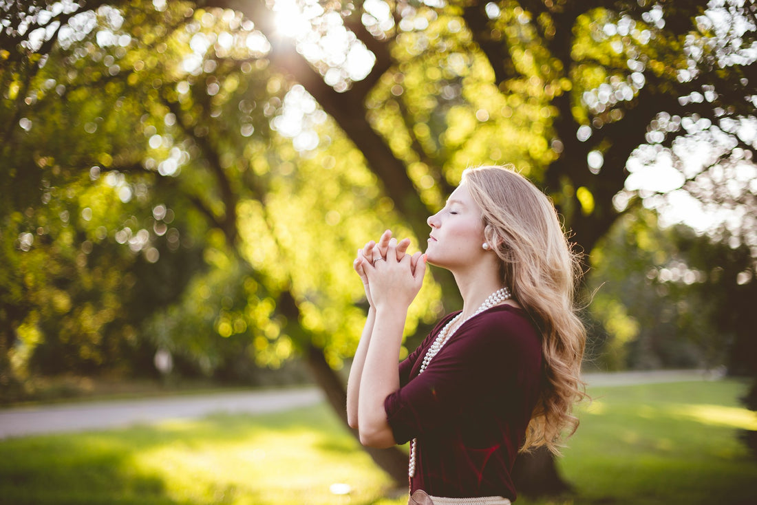 Woman Praying Photo by Ben White on Unsplash